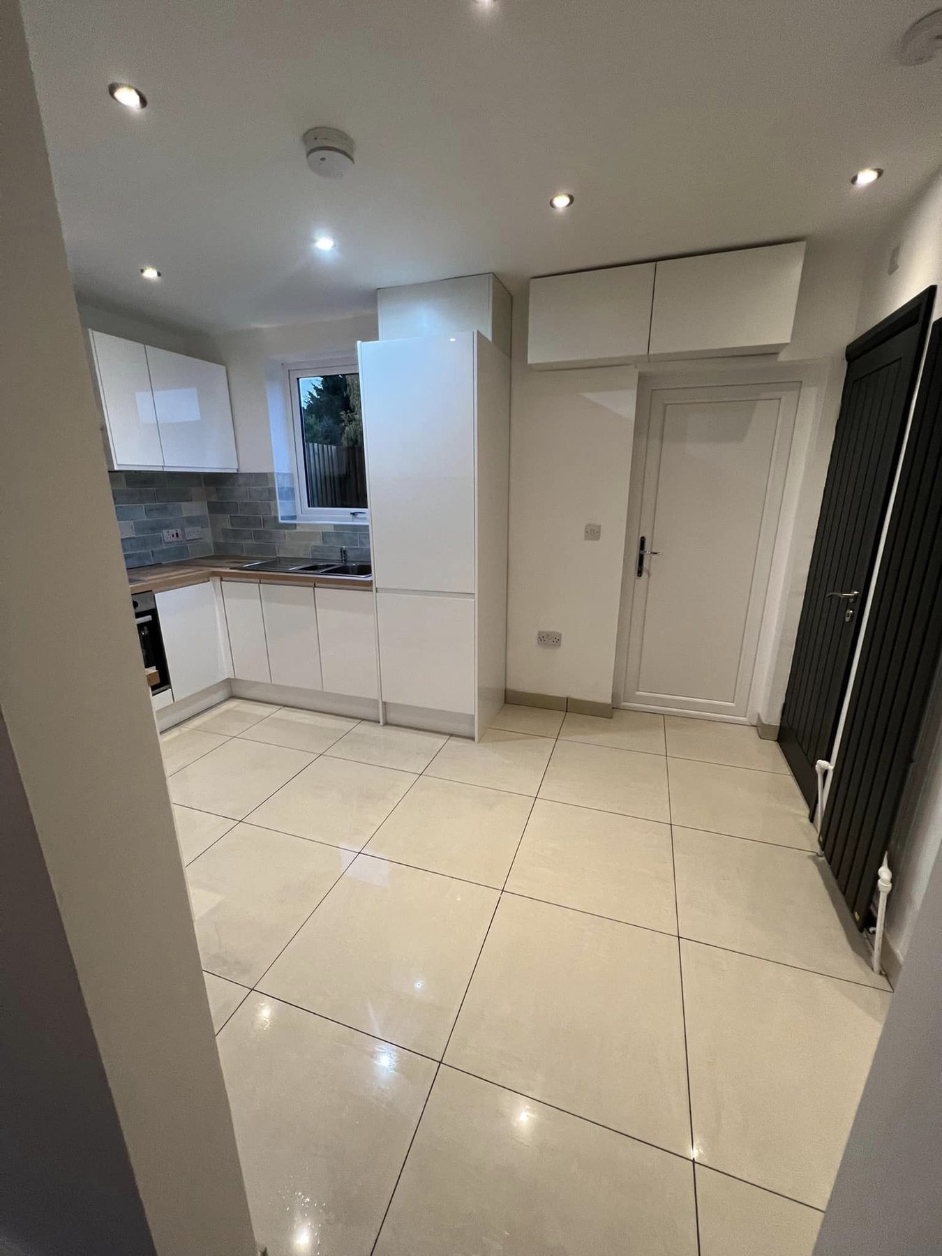 Clean finished rental kitchen with tiled floor