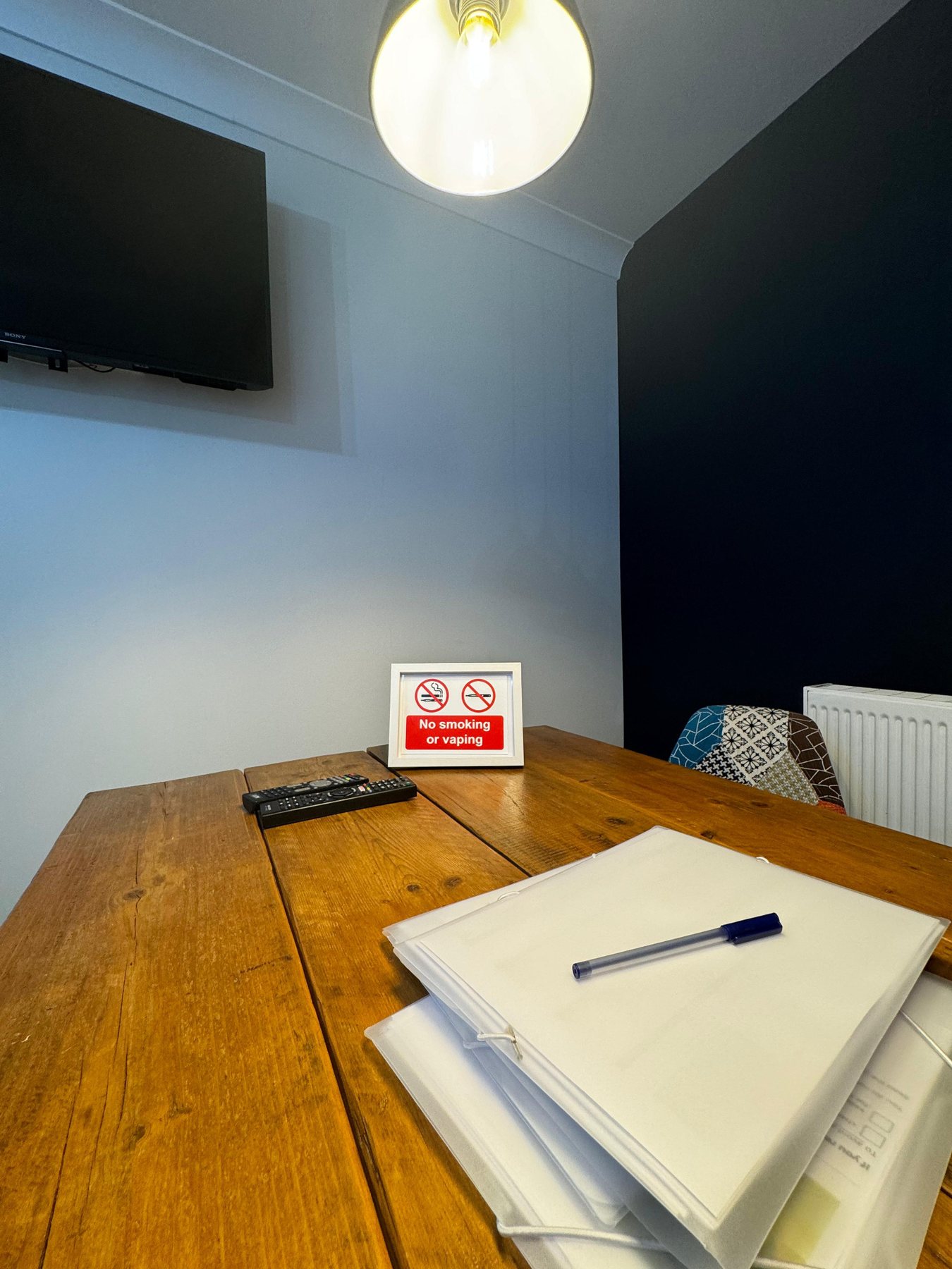 Tenant information folder and no smoking sign on table